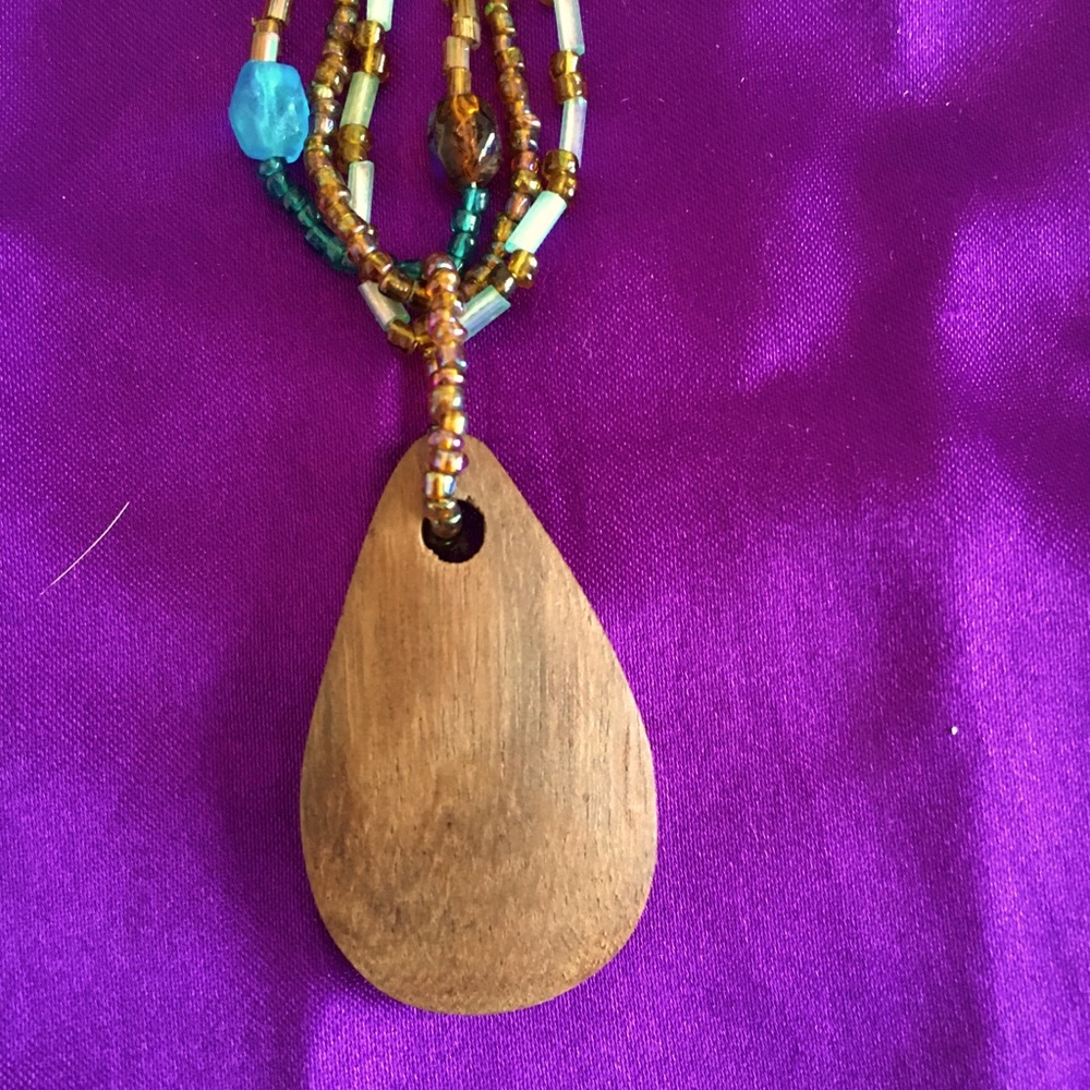 Wooden charm necklace.